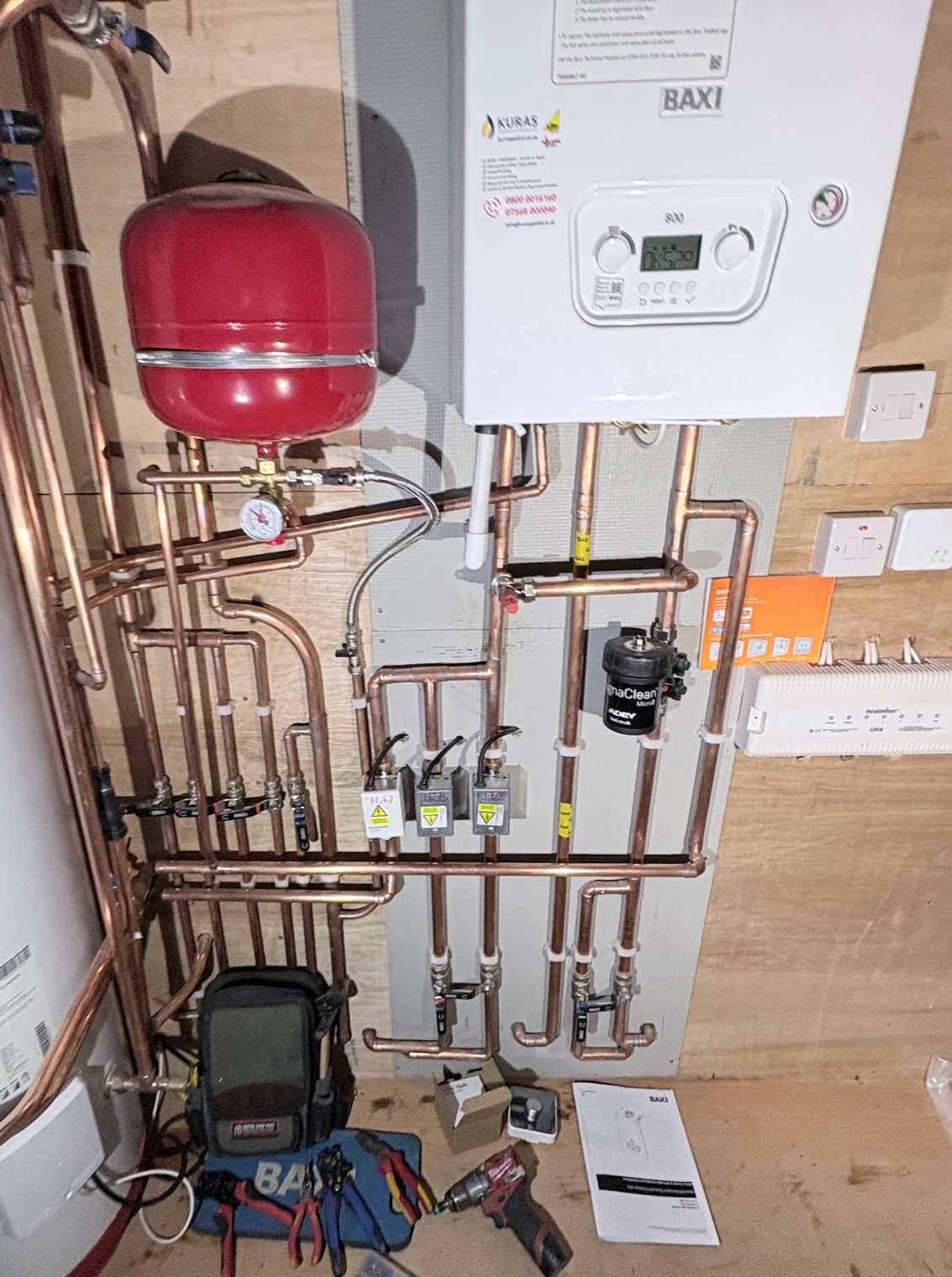 A Baxi boiler and heating system installed by Kuras, with neat copper pipework